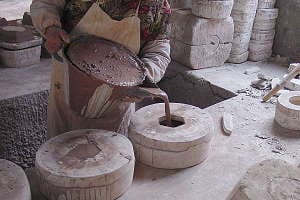 Slip cast technology for bonsai pot production - pouring the casting clay into the molds