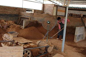 Production of the clay for bonsai pots - ground clay is sieved